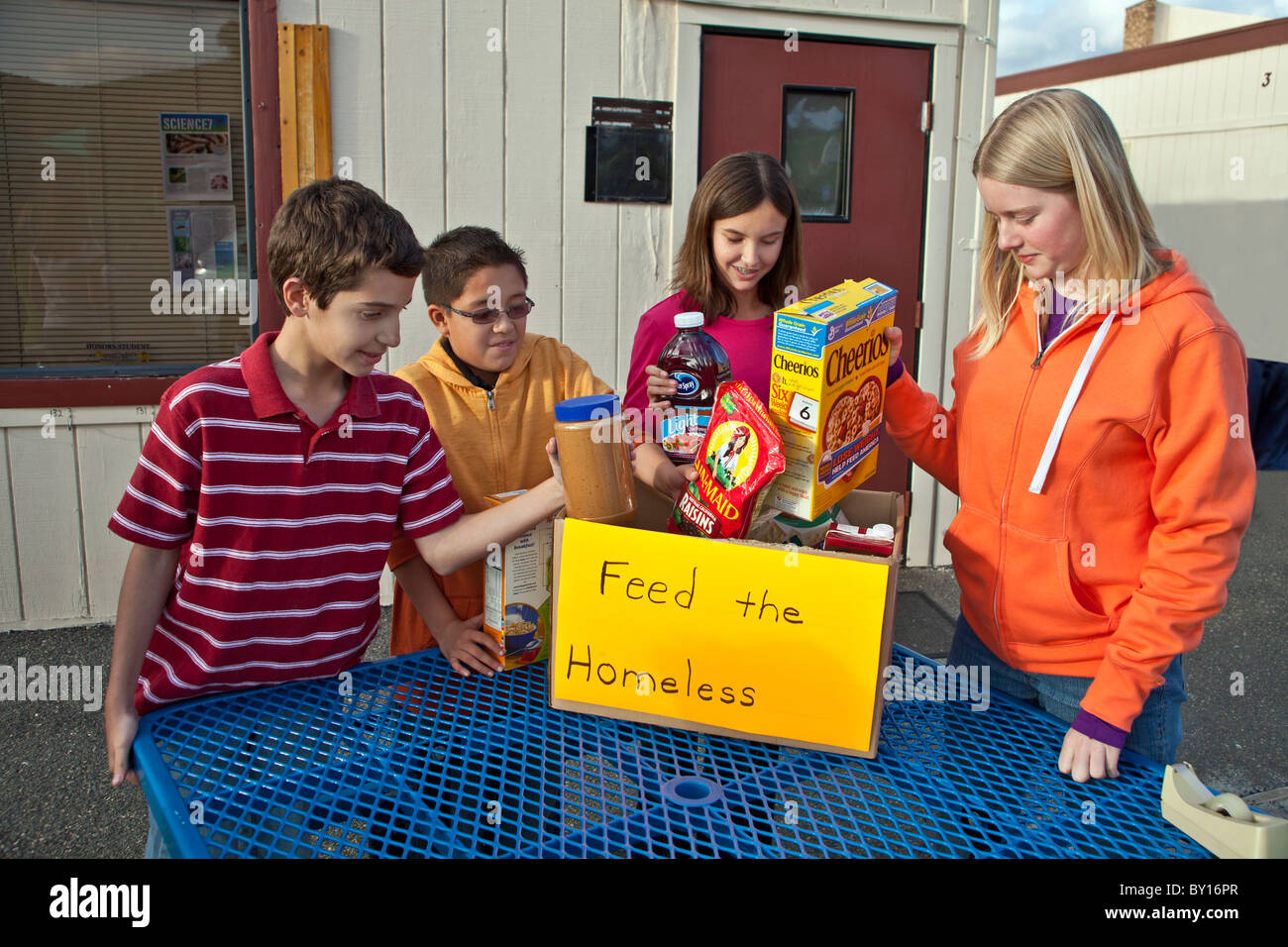 Project Multi ethnic racial cultural racially ethnically diverse multicultural group  Middle school kids collect food people MR © Myrleen Pearson Stock Photo