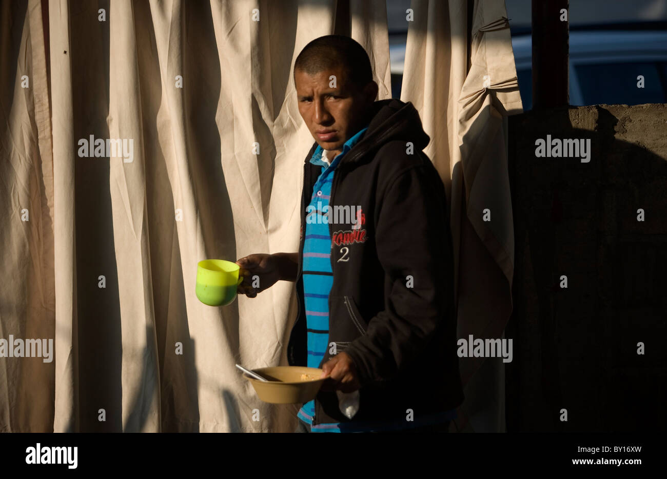 A Central American migrant waks in a shelter located along the railroad in Ixtepec, Oaxaca, Mexico. Stock Photo