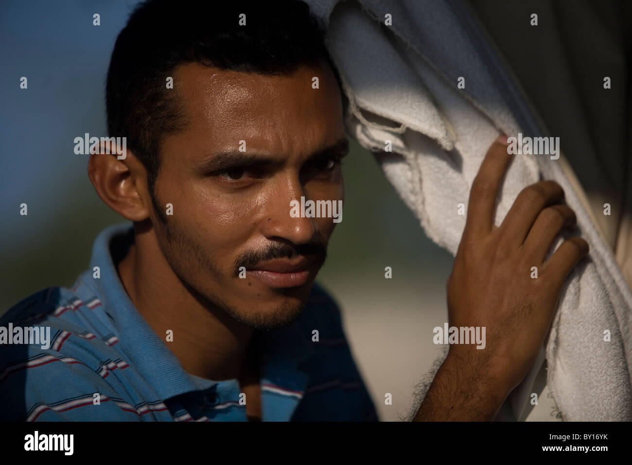 A Central American migrant in a shelter located along the railroad in Ixtepec, Oaxaca, Mexico. Stock Photo