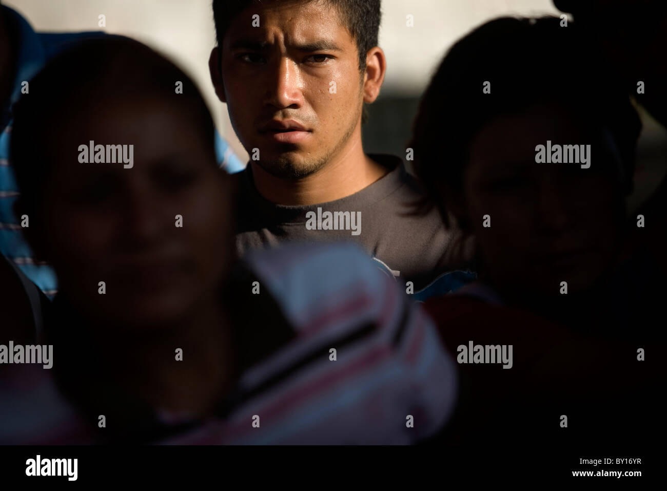 A Central American migrant stands in a shelter located along the railroad in Ixtepec, Oaxaca, Mexico. Stock Photo