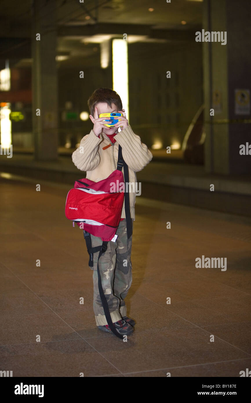 Child making pictures in station Stock Photo