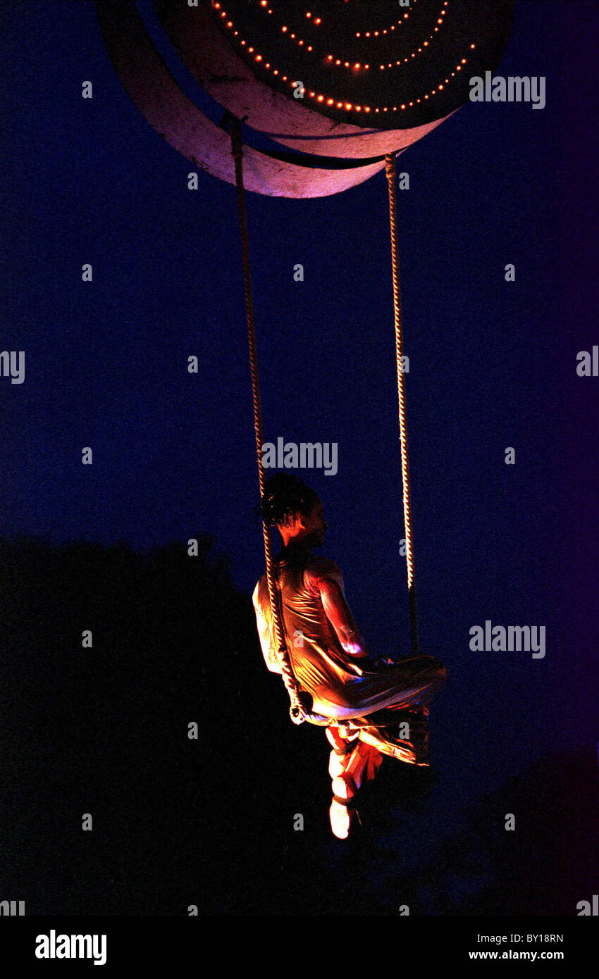 A person preforming on a swing at the Circus Show. Stock Photo