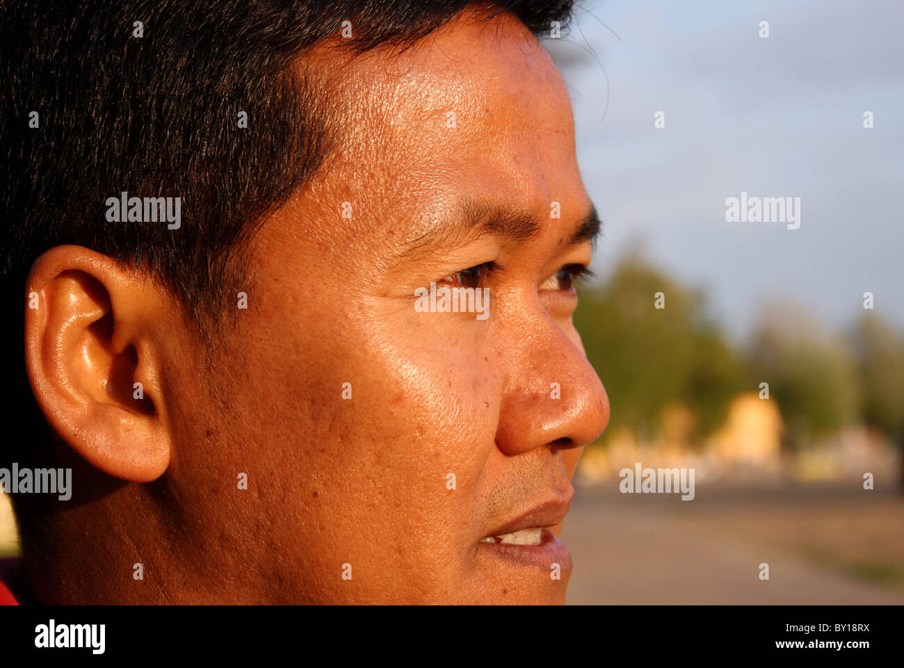 A Thai man at a lake, Skorzecin, Poland Stock Photo