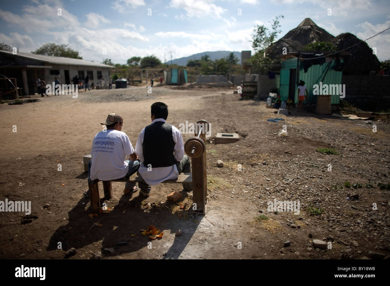 Central American migrant s sit in a shelter located along the railroad in Ixtepec, Oaxaca, Mexico. Stock Photo