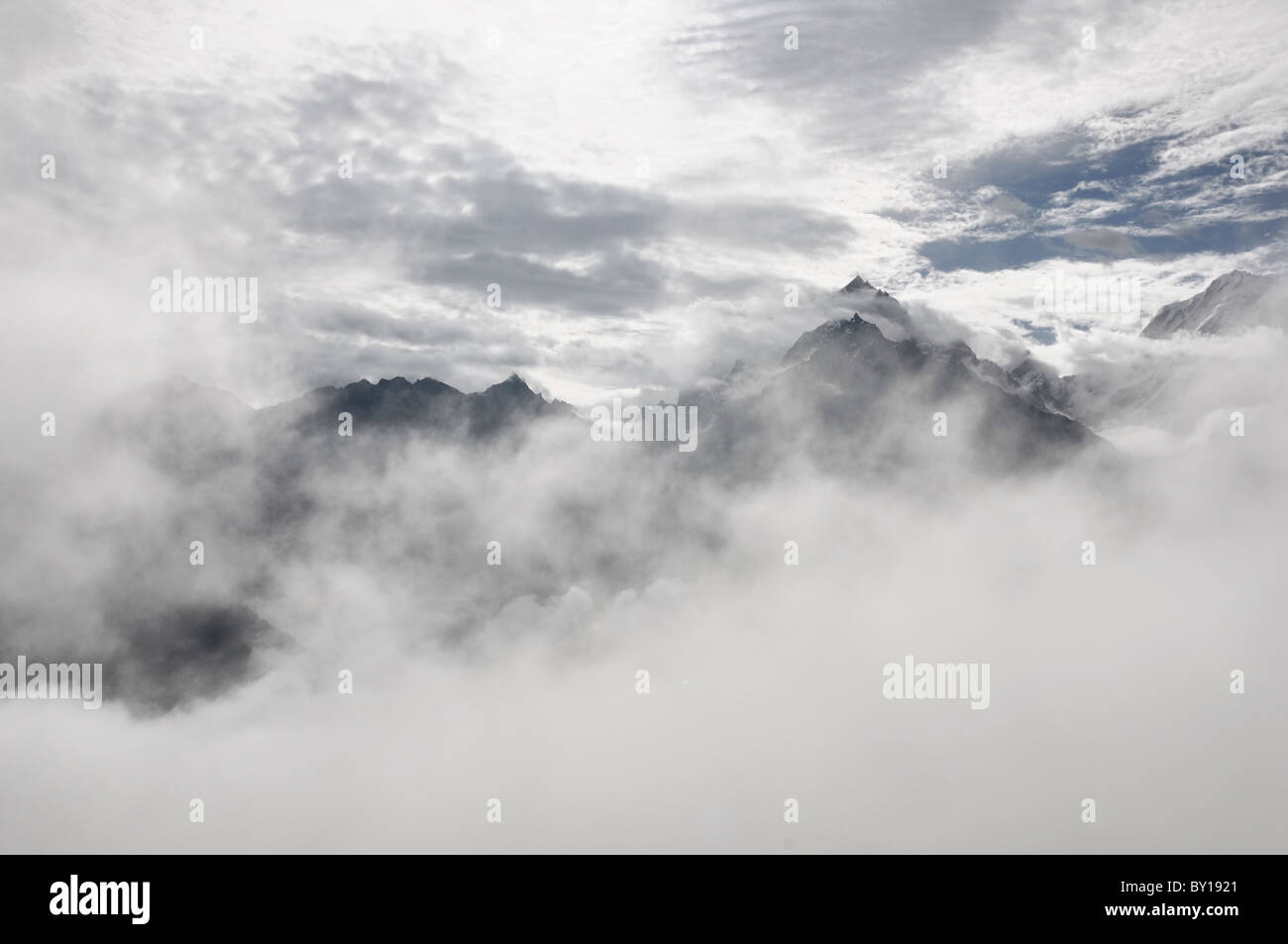 Himalayan peaks shrouded in clouds Stock Photo - Alamy