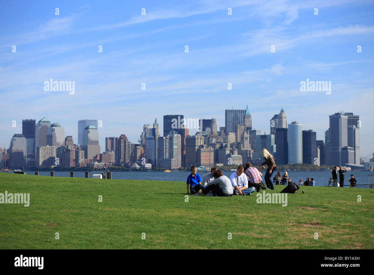Visitors on the grassland of Liberty Island, New York City, United States of America Stock Photo