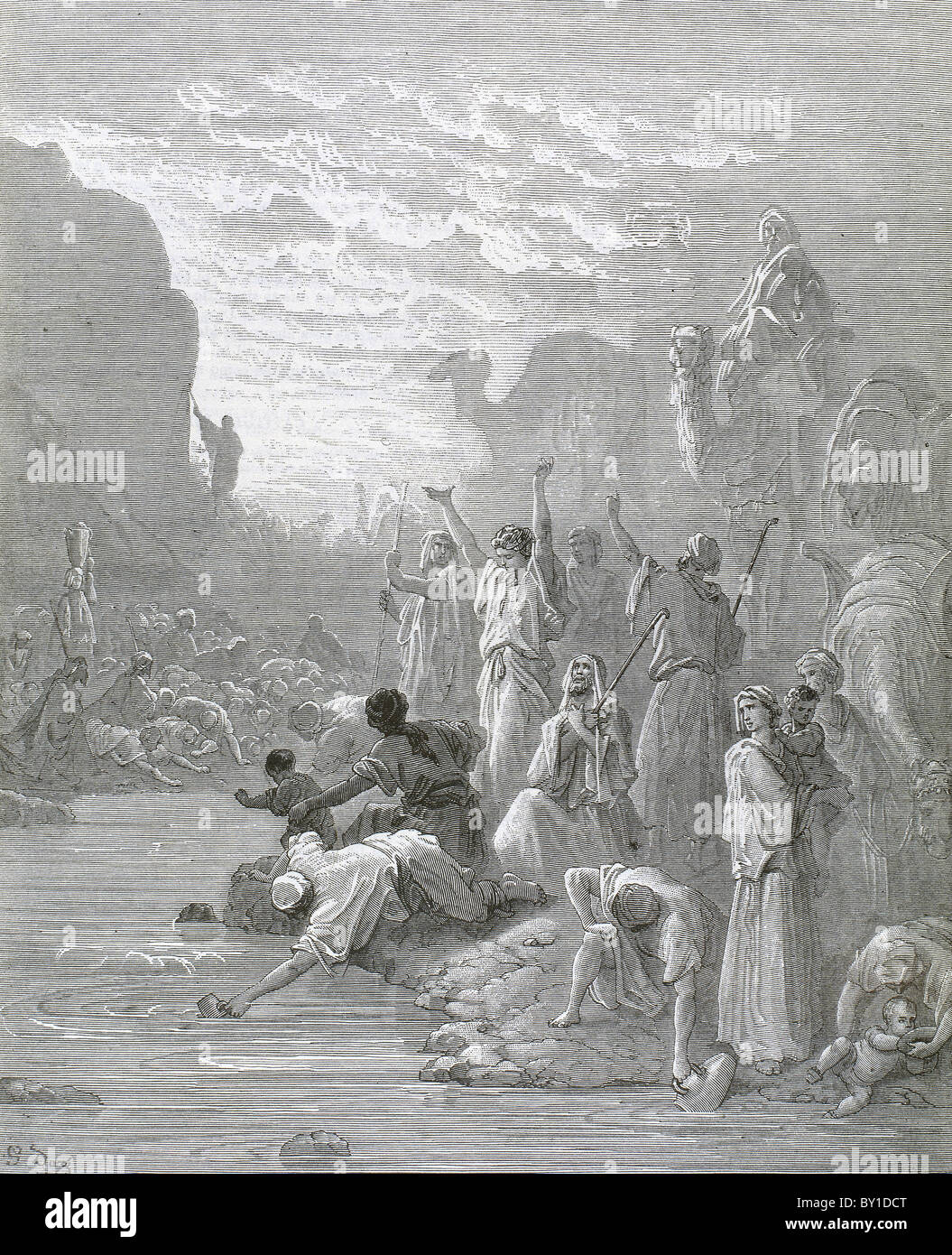 Moses brings forth water from the rock. Book of Exodus. G. Dore engraving. Stock Photo