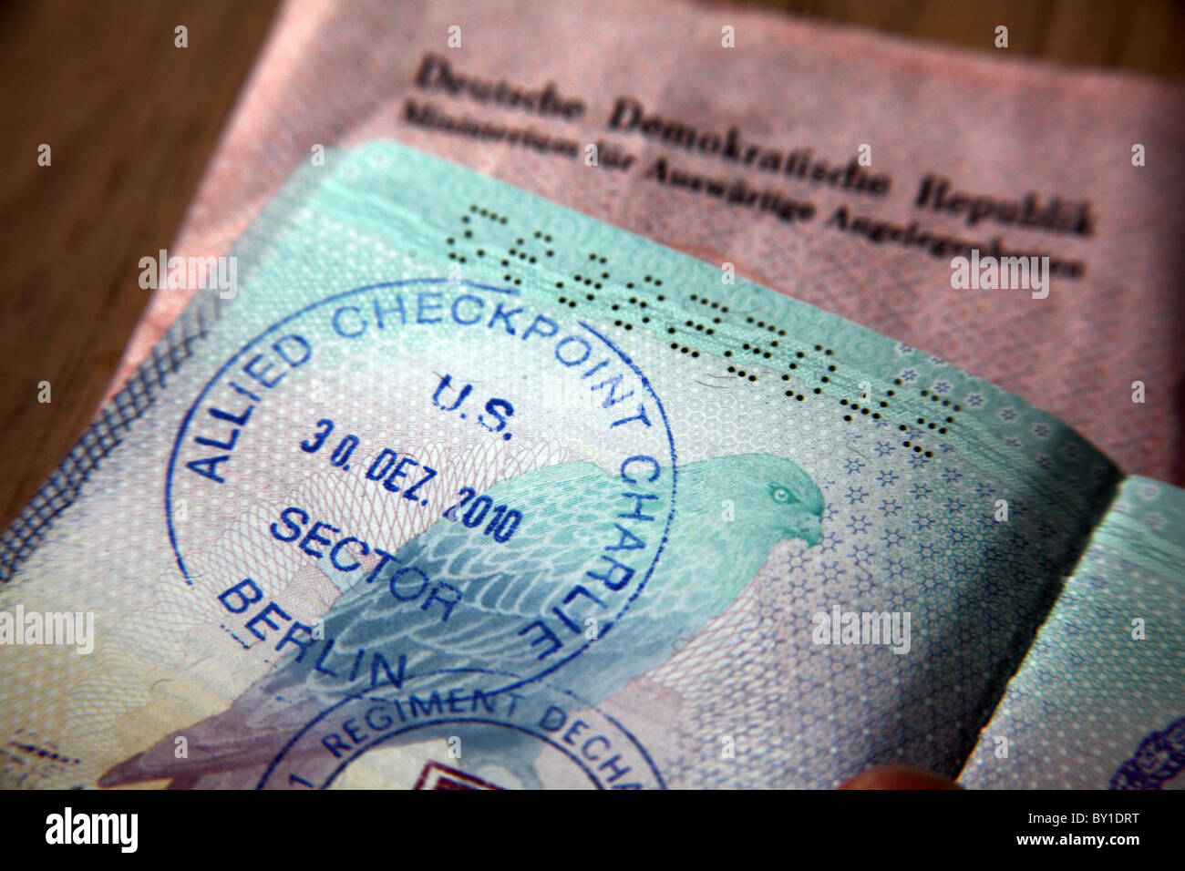 Fake border stamps in a passport; Checkpoint Charlie, Berlin at the old