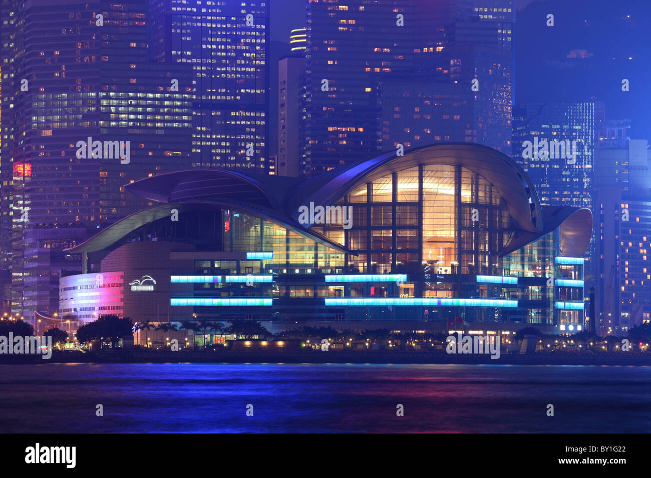 Hong Kong Convention and Exhibition Centre illuminated at night Stock
