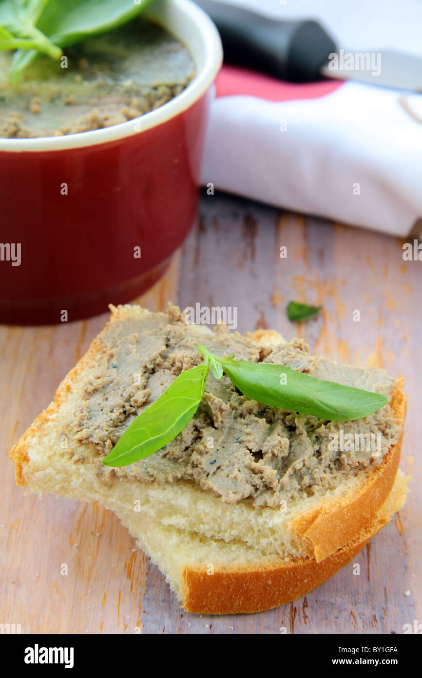 Homemade chicken liver pate on a piece of bread Stock Photo