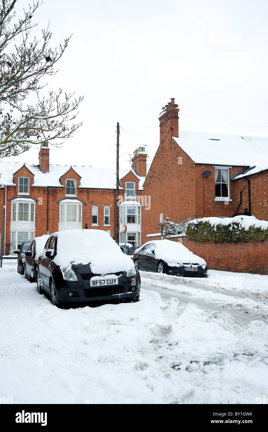 Residential houses and cars parked in the snow, Wellesbourne Grove