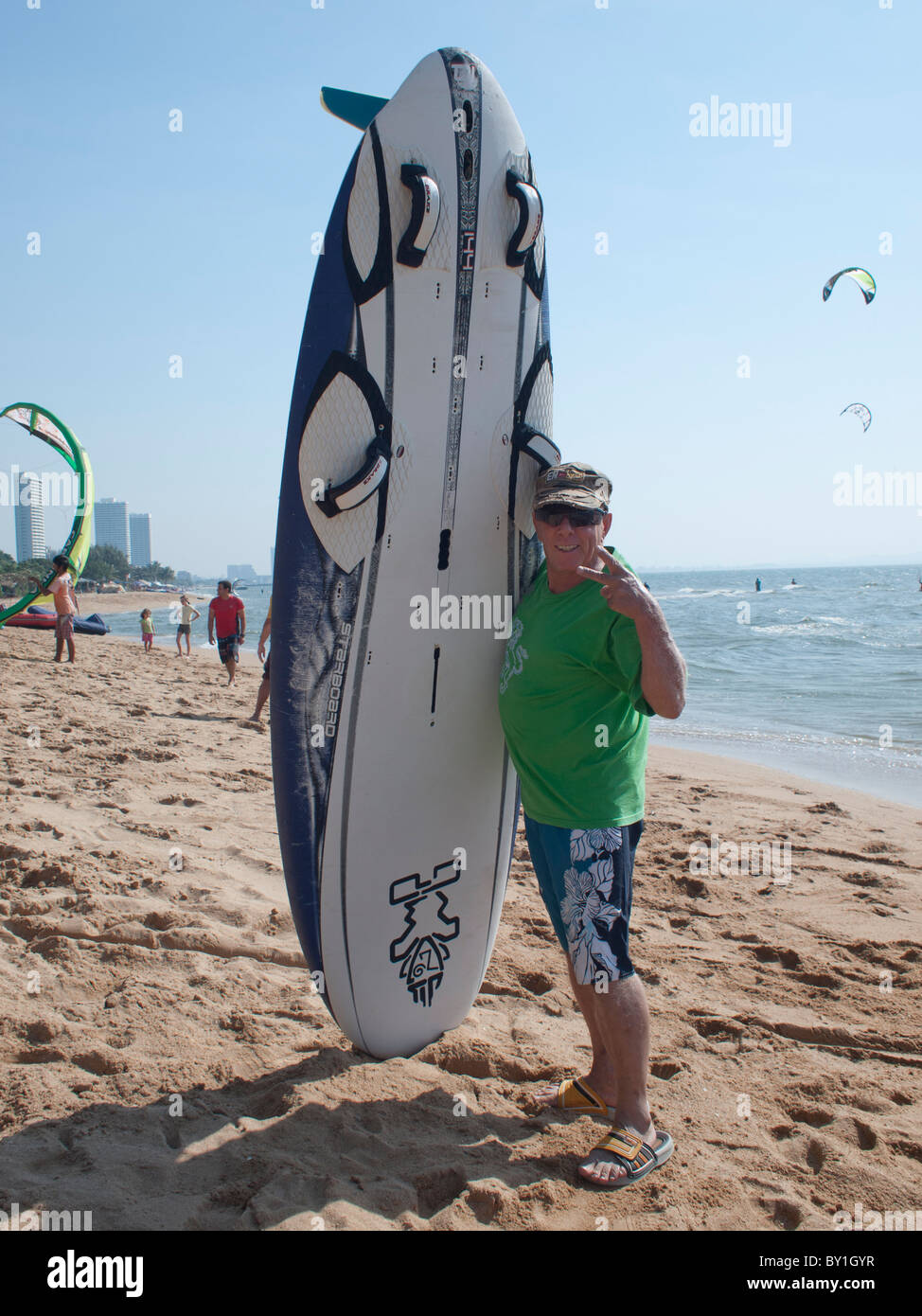 An old man with his favorit sport, windsurfing. Stock Photo