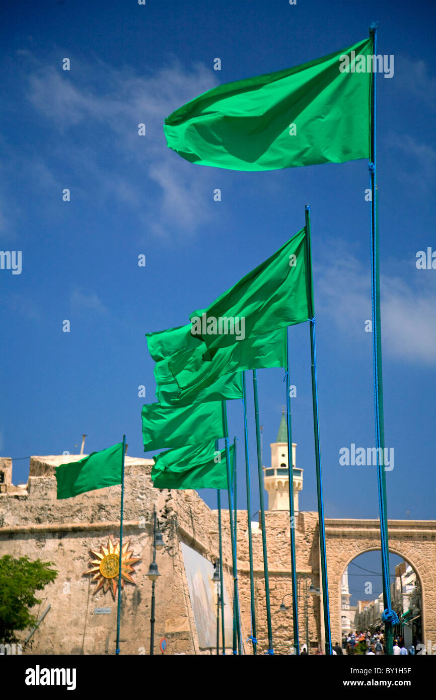 Tripoli, Libya; Libyan flags prominently displayed on Green Square in front of the entrance to the old Medina of Tripoli Stock Photo
