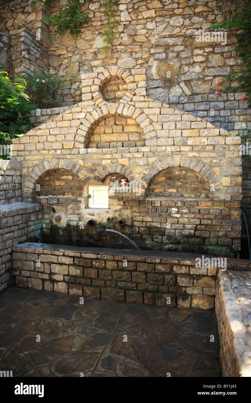 Old drinking water fountain in a village square, Turkey Stock Photo