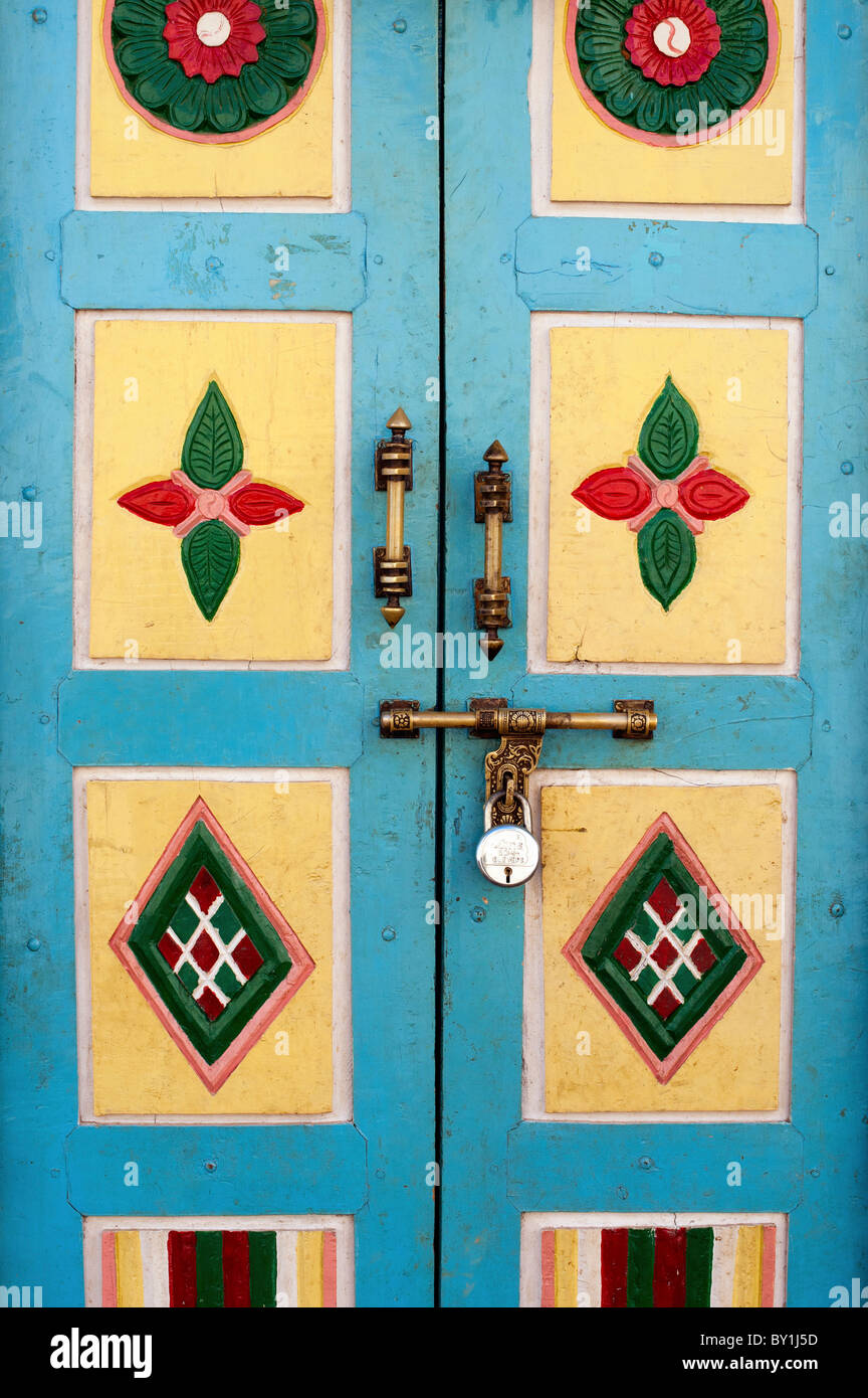 Old Indian colourful door with ornate handles and lock. Andhra Pradesh, India Stock Photo