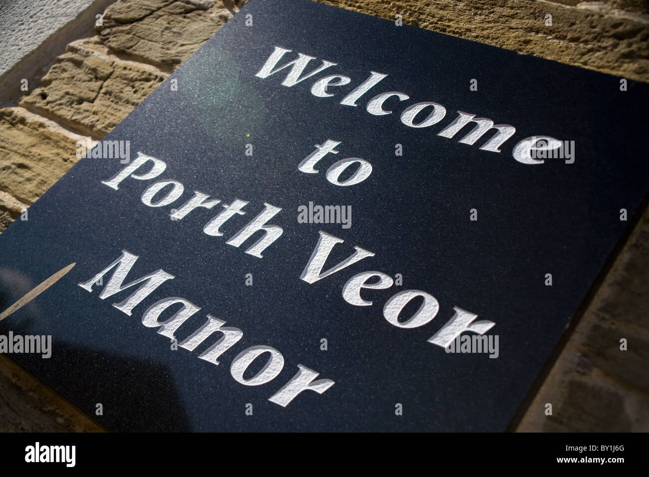 porth veor manor slate plaque mounted on wall with white text Stock Photo
