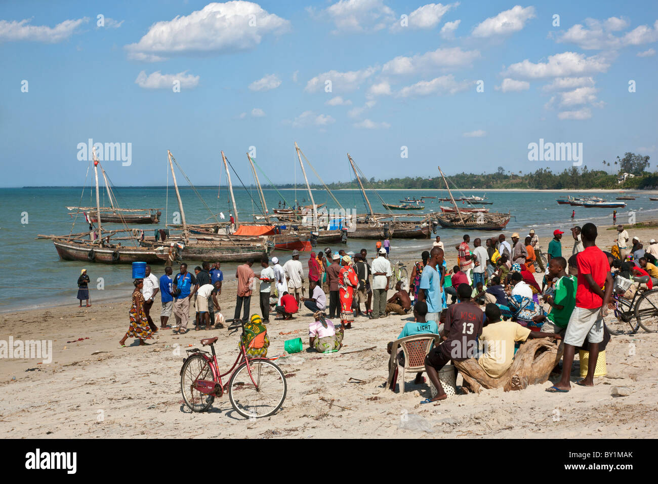 The busy harbour at Bagamoyo where fishermen land their catches and motorised dhows from Zanzibar off-load merchandise. Stock Photo