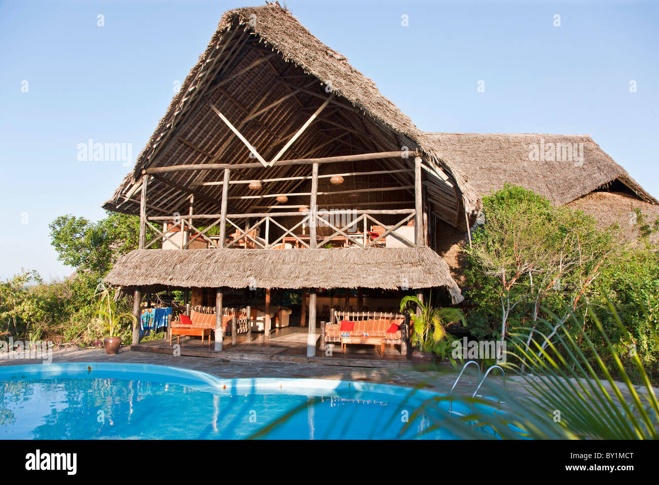 The main building and swimming pool of the Lazy Lagoon Island Hotel situated on a small island between Dar-es-Salaam and Stock Photo