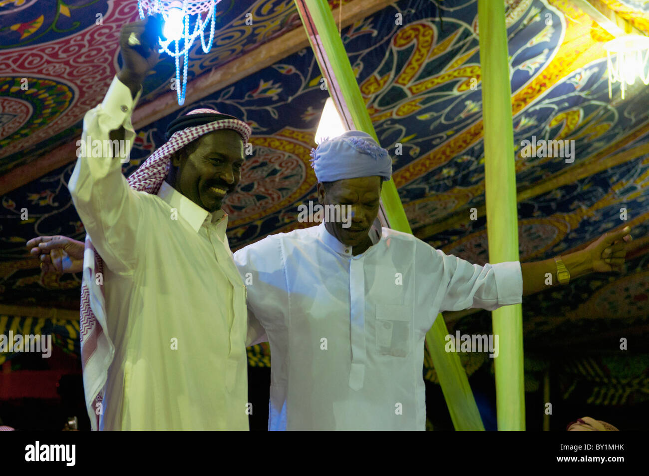 Guests celebrate with dance during a traditional Bedouin wedding celebration. El Tur, Sinai Peninsula, Egypt Stock Photo