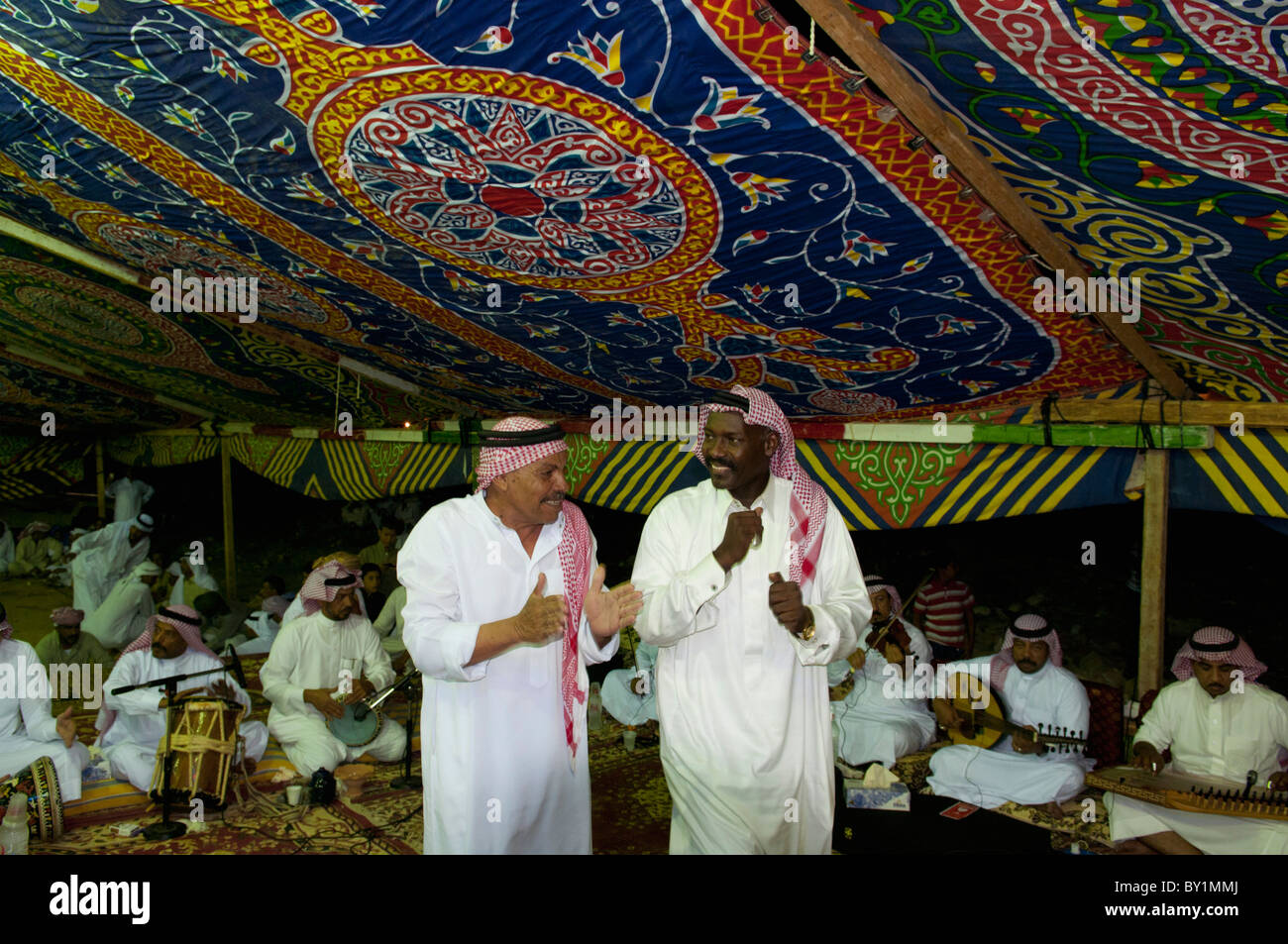 Guests celebrate with dance during a traditional Bedouin wedding celebration. El Tur, Sinai Peninsula, Egypt Stock Photo