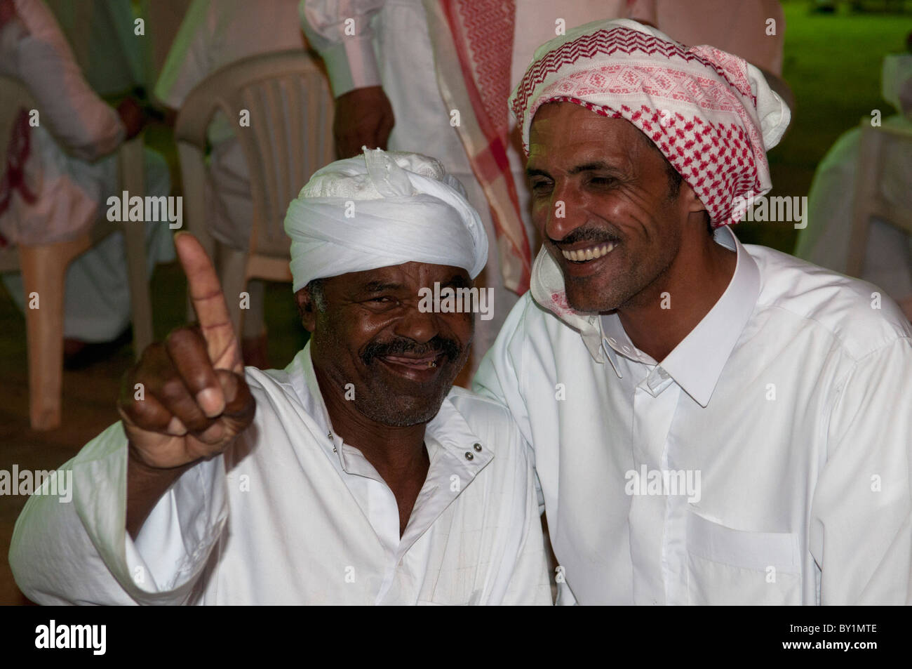 Father and son celebrate at a traditional Bedouin wedding. El Tur ...