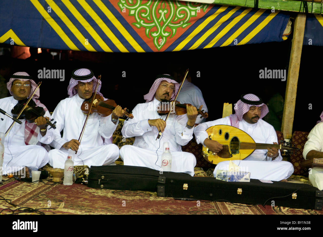 Saudi Arabian musicians play violin and oud at traditional wedding celebration. El Tur, Sinai