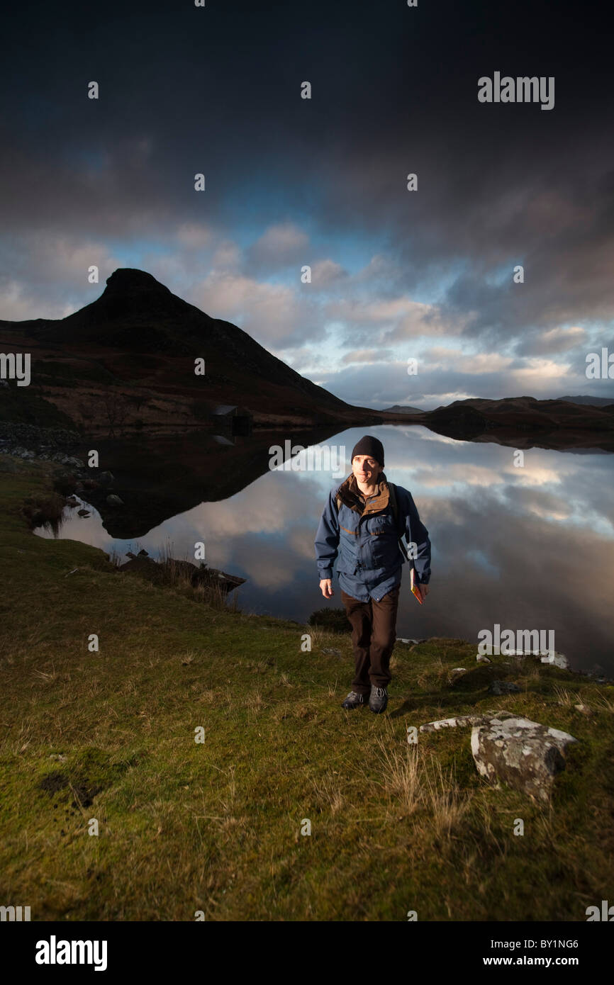 Walker at Lake Cregennen in Mid Wales Stock Photo