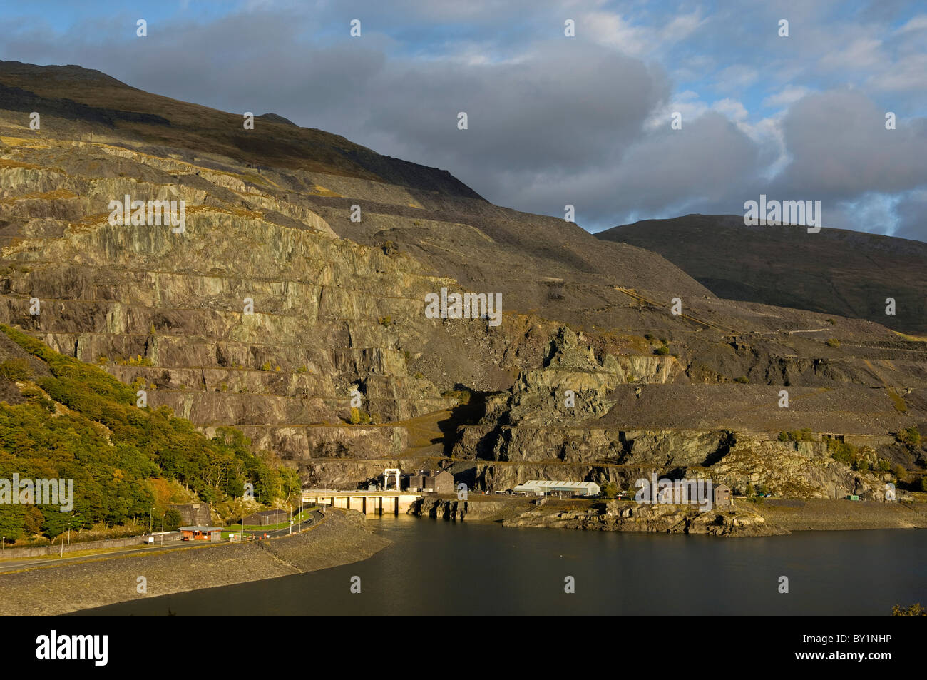 UK, North Wales, Snowdonia.  Terraced slate quarry above the hydro-electric power station at Llyn Peris, Llanberis. Stock Photo