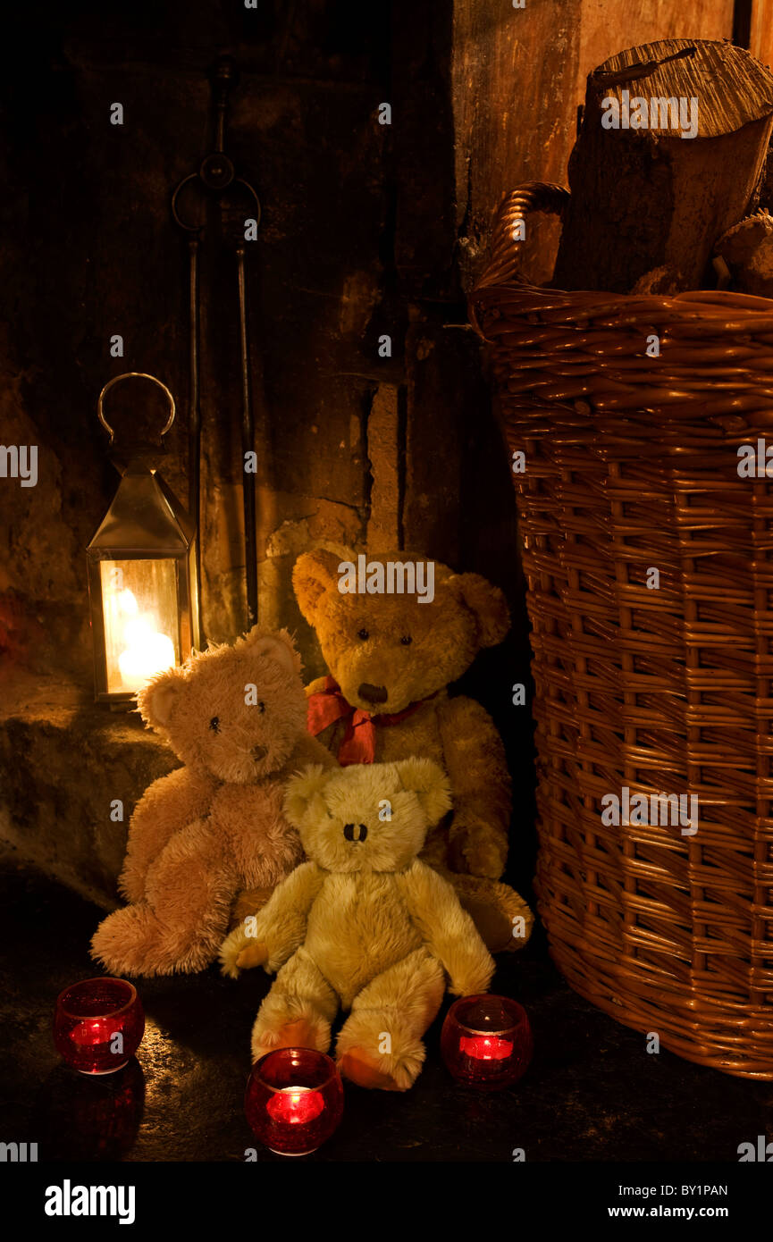 Gilar Farm, Snowdonia, North Wales.  Teddy bears, candles and a lantern beside the fireplace at Gilar. Stock Photo
