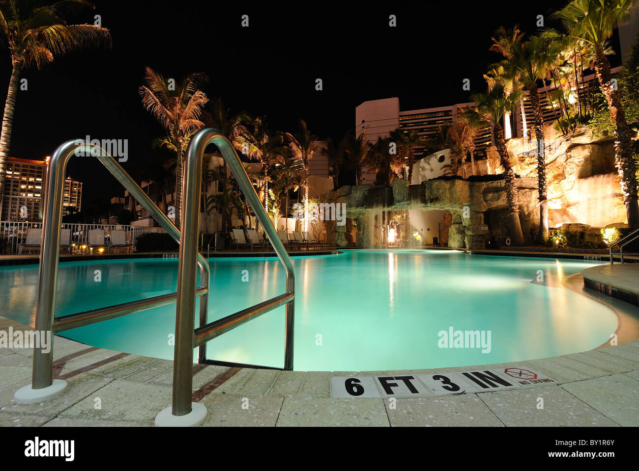 A resort swimming pool at night Stock Photo