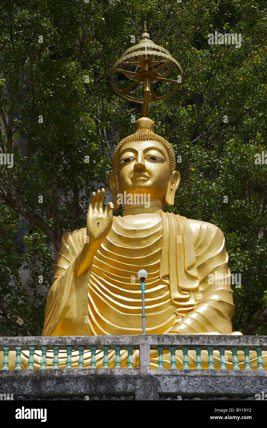 A Buddha at the side of the road in Pang Na, Thailand Stock Photo