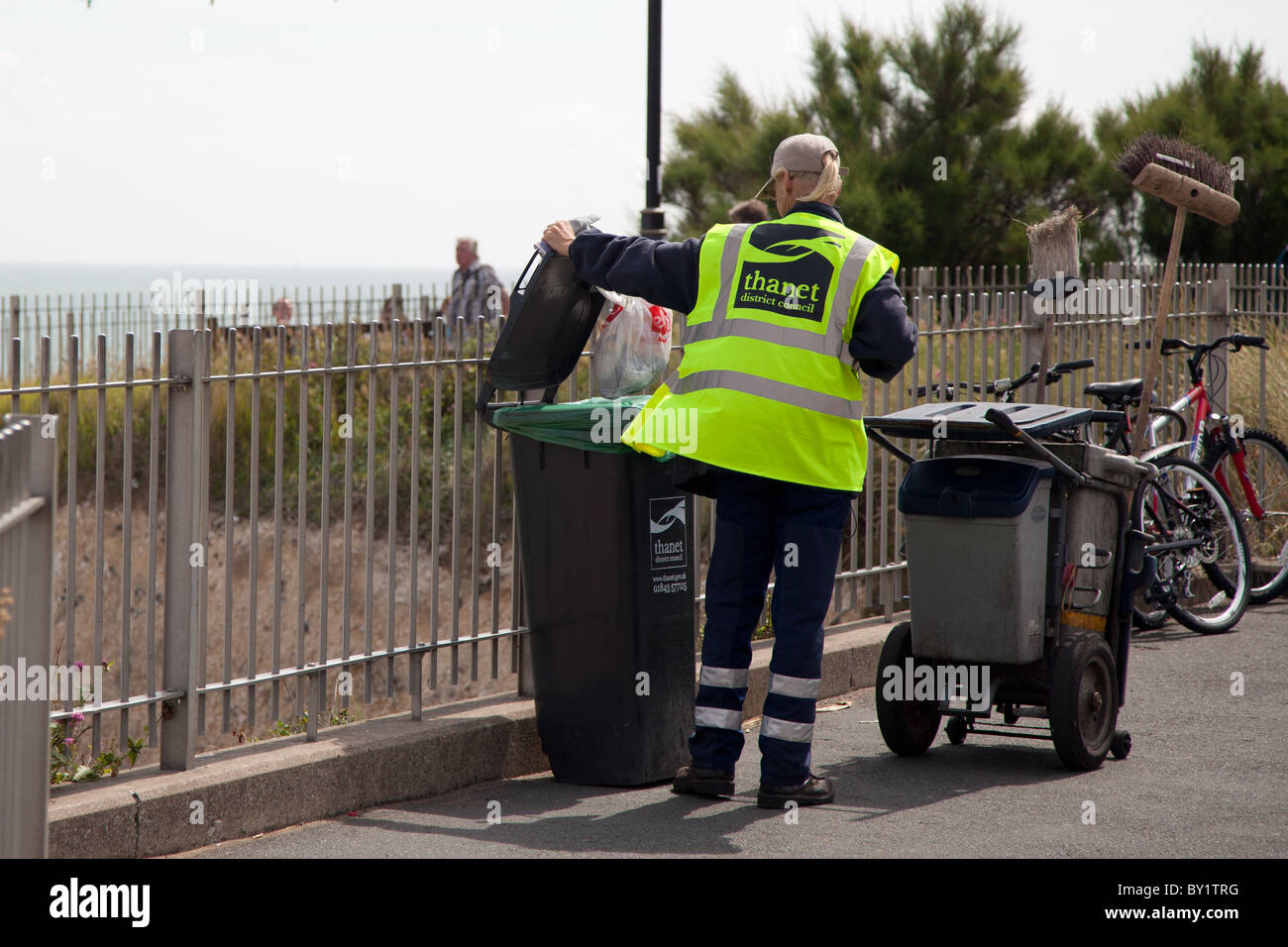 Council worker emptying bins Stock Photo