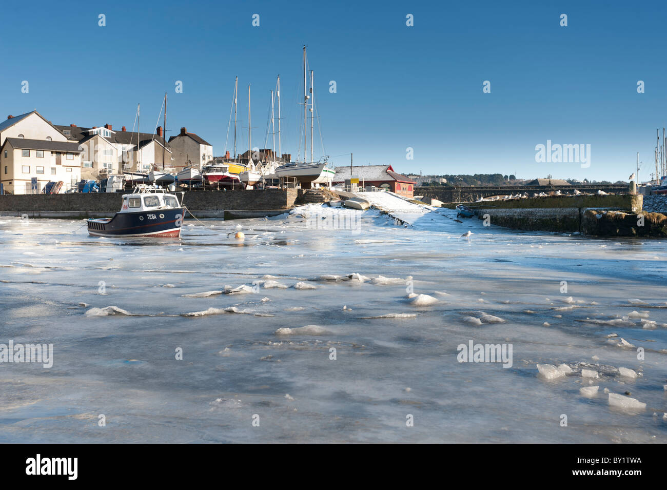 December 25 2010. Boats Aberystwyth harbour frozen into the thick ice after another night of sub-zero temperatures. Stock Photo