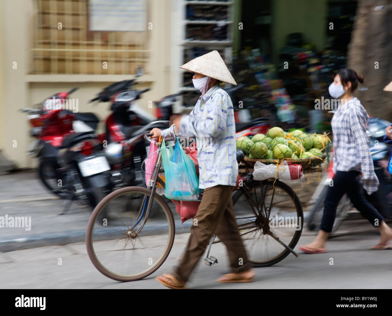 hawker in a street. Hanoi, Vietnam Stock Photo Alamy