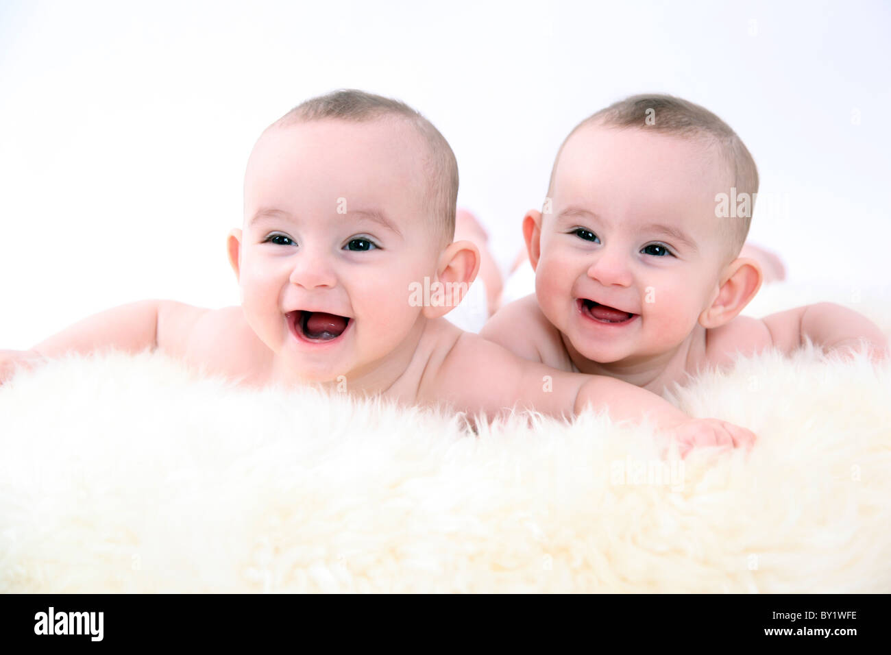 twin baby girls smiling Stock Photo - Alamy
