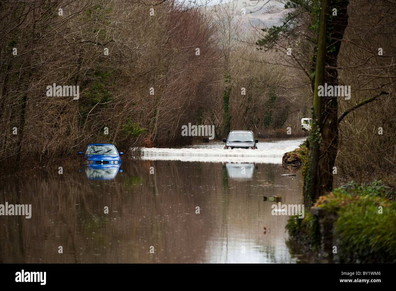 a car driving through Floods on the A487 road near Machynlleth, Powys, wales Jan 13 2011; Stock Photo