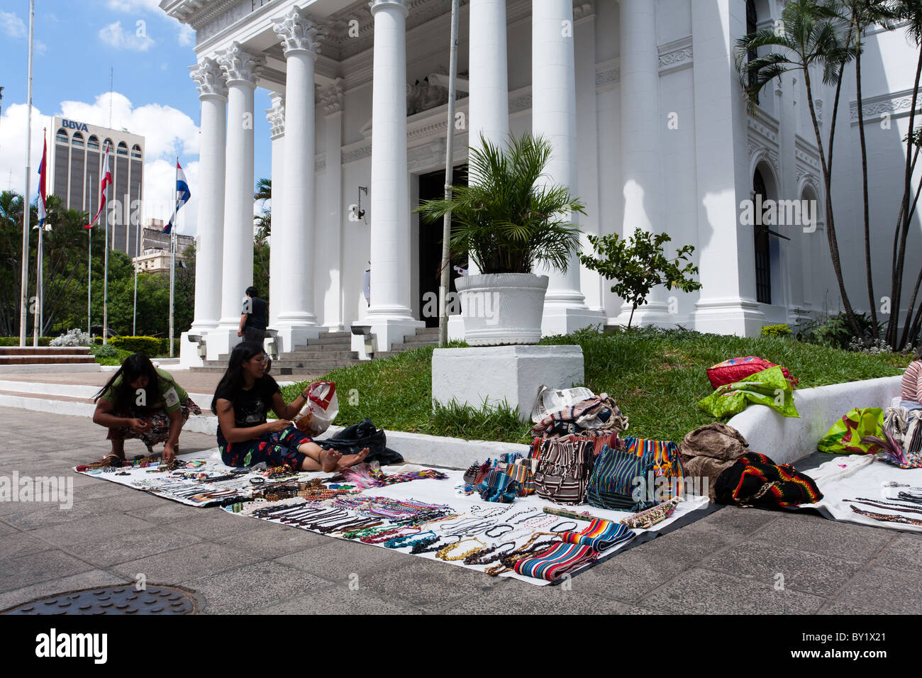 Indigenous women sell their weavings and handicrafts on sidewalk, Calle (Street) Palma in historic city center, downtown Asuncion, Paraguay Stock Photo