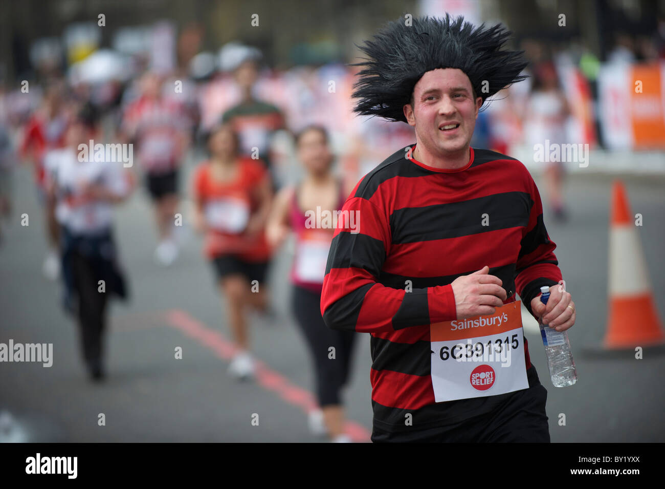 Costume clad runners take part in the Sainsbury's Sport Relief Mile in