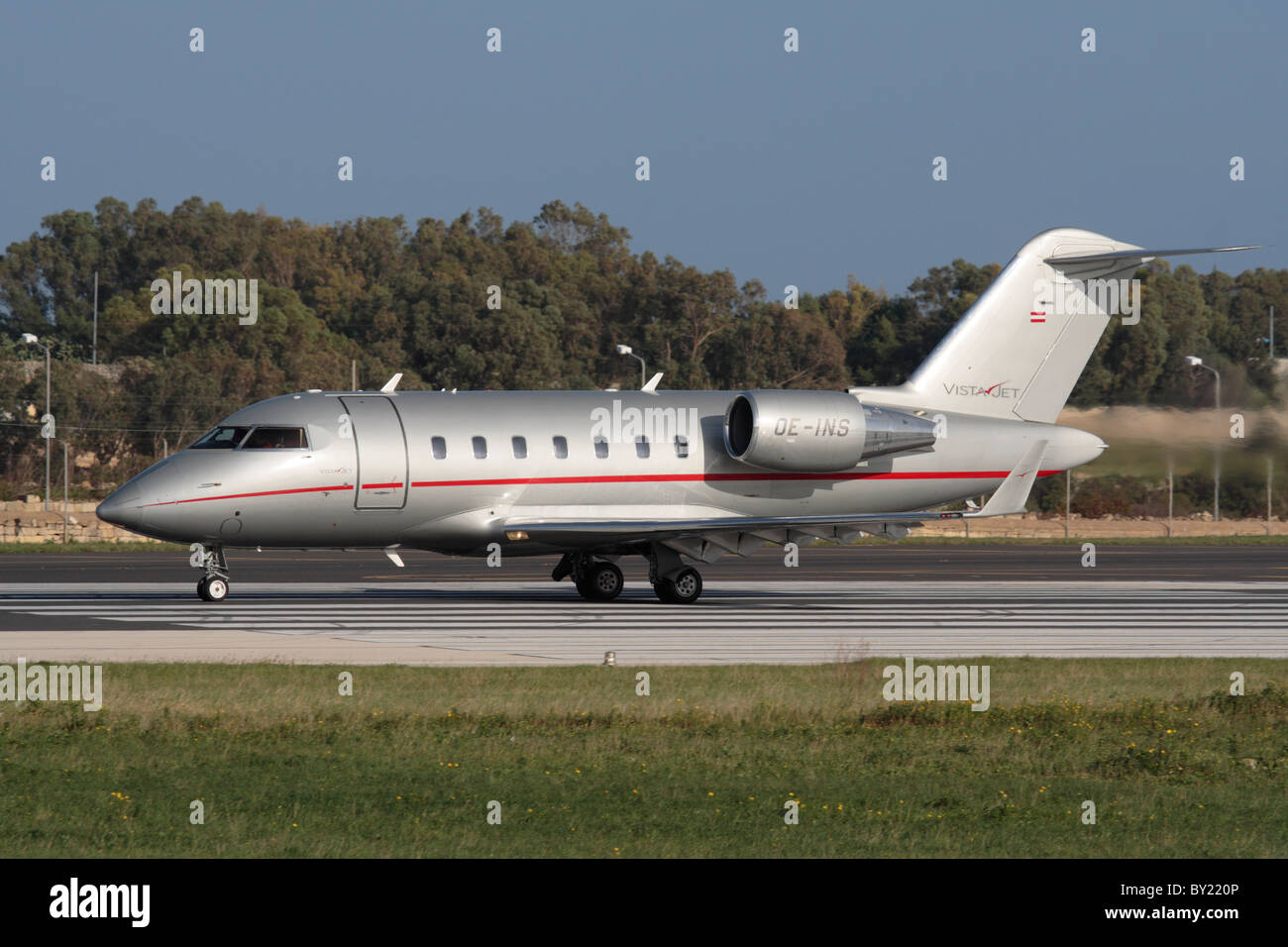 Bombardier Challenger 605 executive jet operated by VistaJet on the runway ready for takeoff from Malta Stock Photo