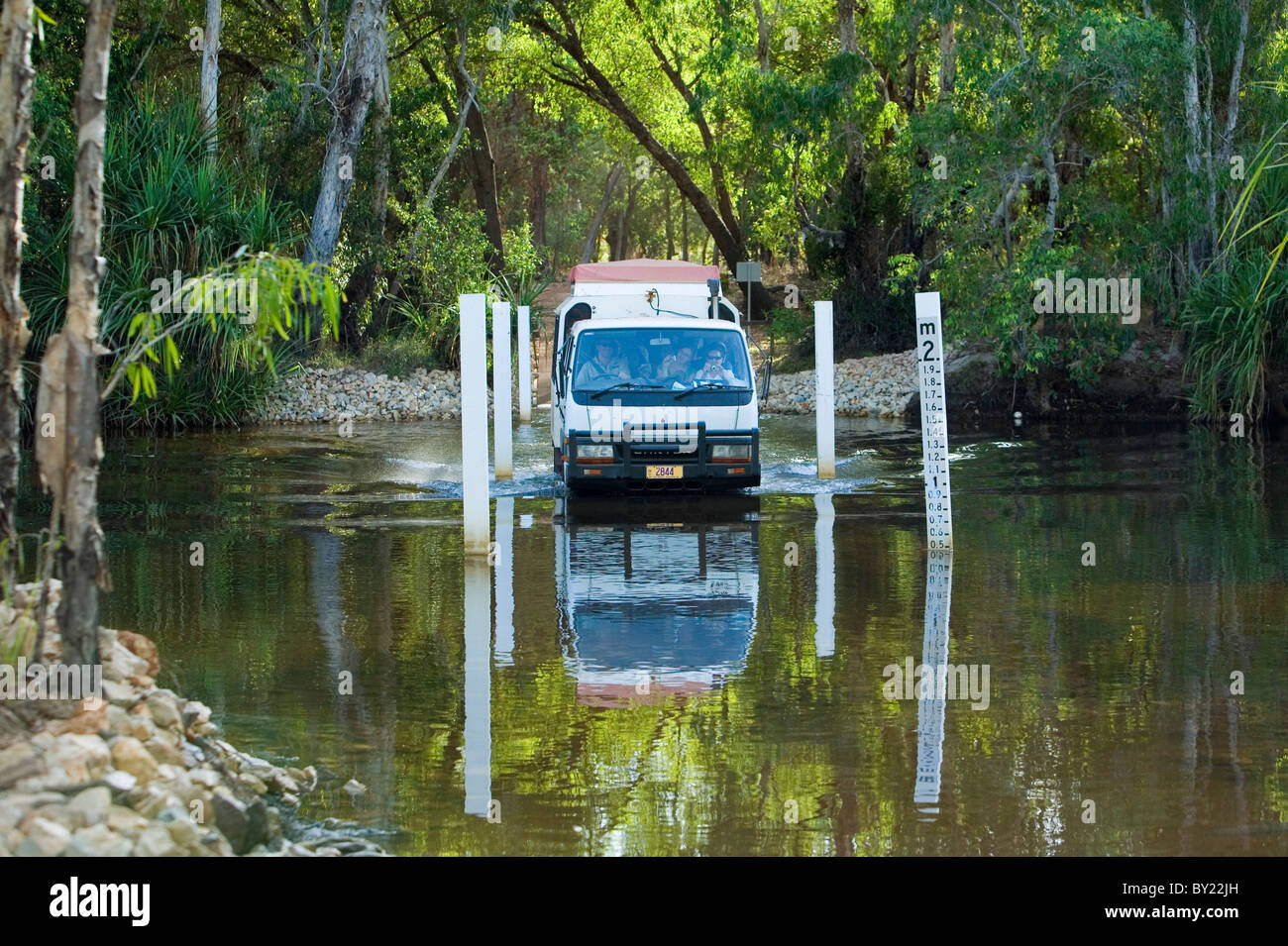 Australia, Northern Territory, Kakadu National Park.  A four wheel drive vehicle crosses Jim Jim Creek. Stock Photo