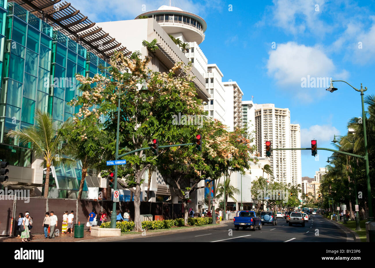 Busy main street of Honolulu Waikiki Hawaii on Kalakaua Avenue with traffic and shopping in Oahu Stock Photo