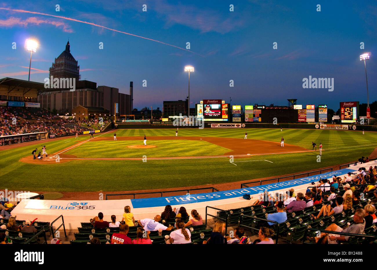 Night professional baseball game at Frontier Field Stadium in Rochester New  York with city and Kodak Rochester Red Wings play Stock Photo - Alamy