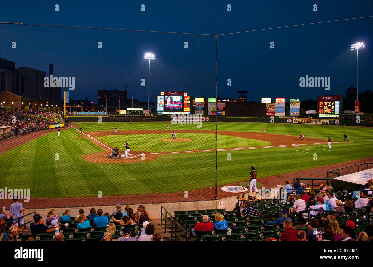 Night professional baseball game at Frontier Field Stadium in Rochester New  York with city and Kodak Rochester Red Wings play Stock Photo - Alamy