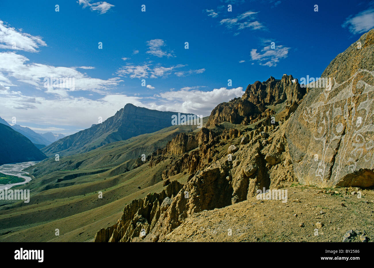 India, Himachal Pradesh, Spiti, Spiti Valley, Dhankar. A stone-carved Tibetan Buddhist mantra marks part of the steep trail Stock Photo