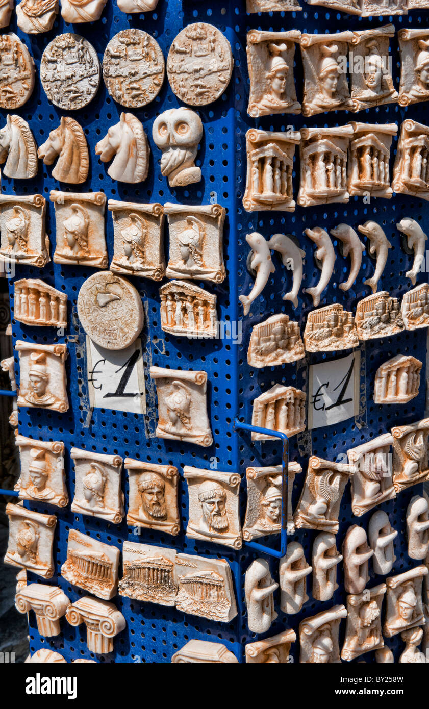 Display of Greek souvenirs stone plaques on rack in downtown shopping