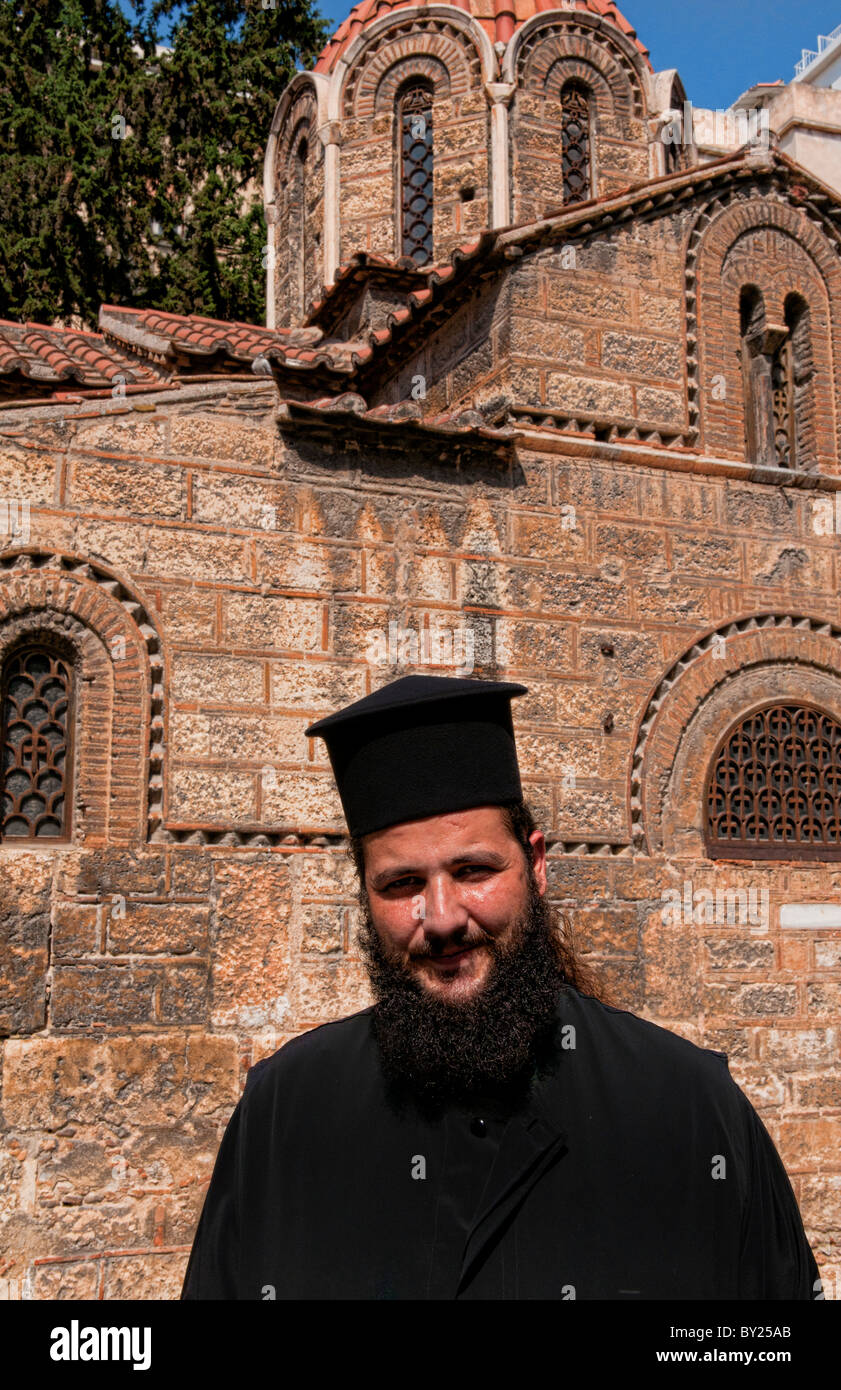 Greek Orthodox Priest in Plaka area of Athens Greece with shopping and