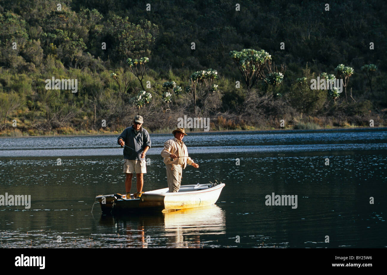 Kenya, Mount Kenya. Flyfishing for trout on Lake Rutundu Stock Photo