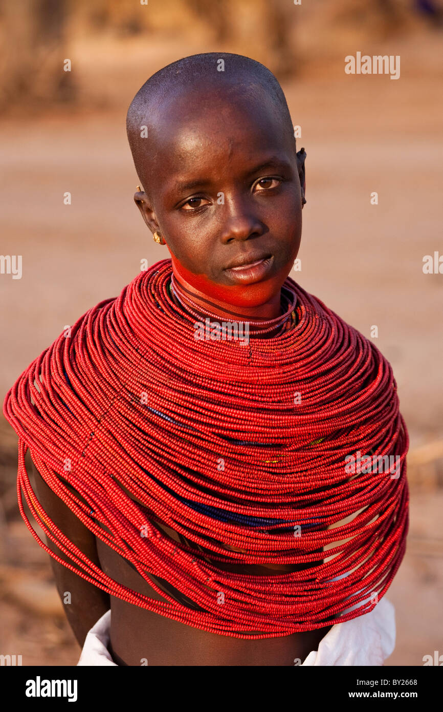 Kenya, Samburu District.  Young Samburu girl in traditional beaded necklaces. Stock Photo