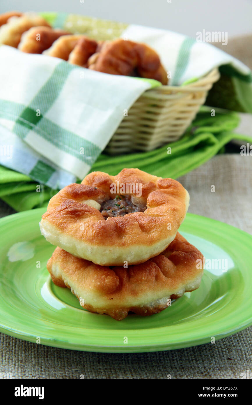 homemade fried pies with meat on the table Stock Photo