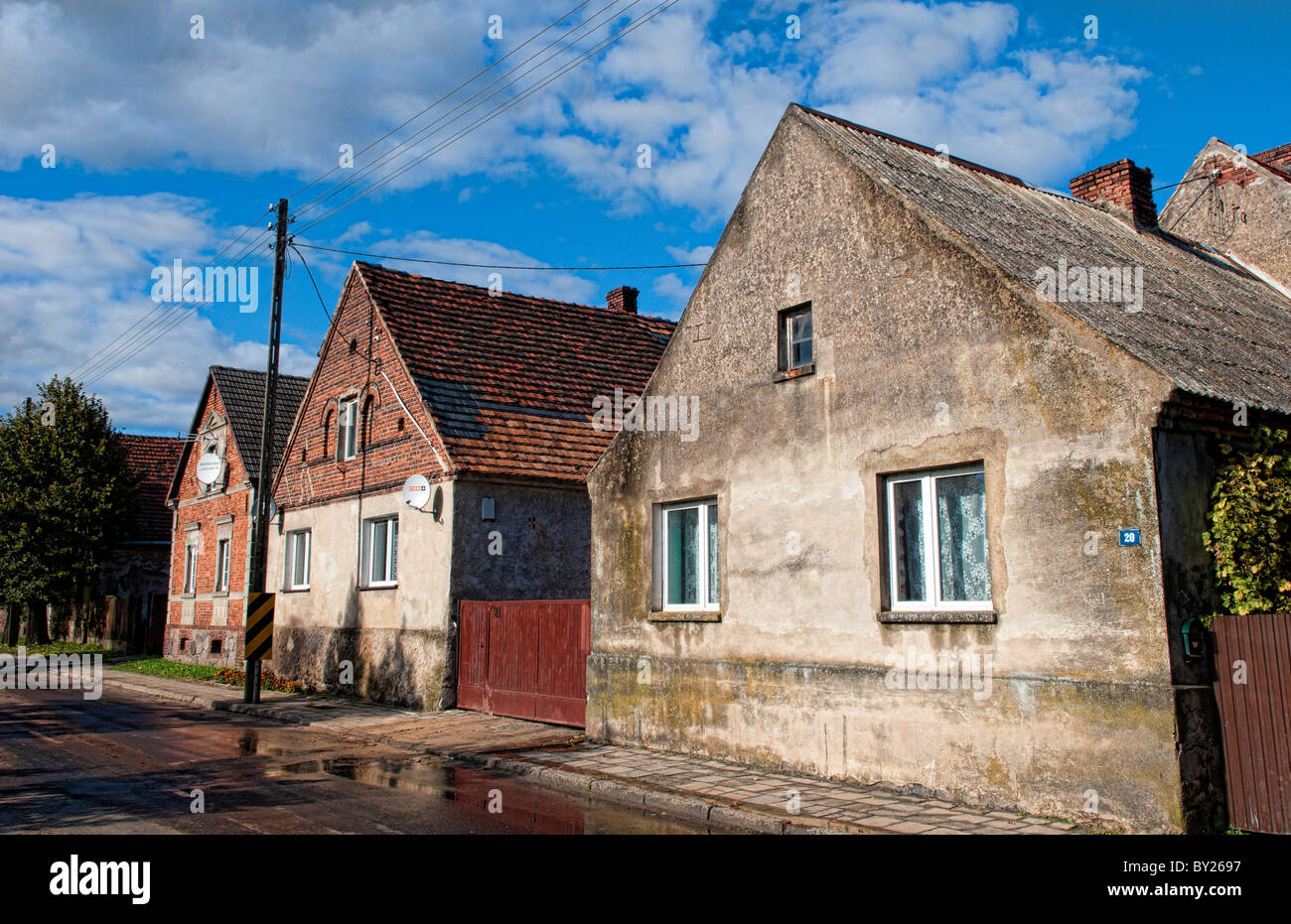 Village of Poznan Poland houses on main street of local worn buildings
